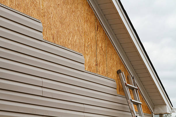 Professional Storm Damage Siding Repair technician working in Alexandria, PA